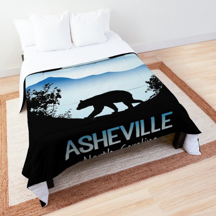 Asheville souvenir design with black bear and tree silhouette against the Blue Ridge Mountains of North Carolina.