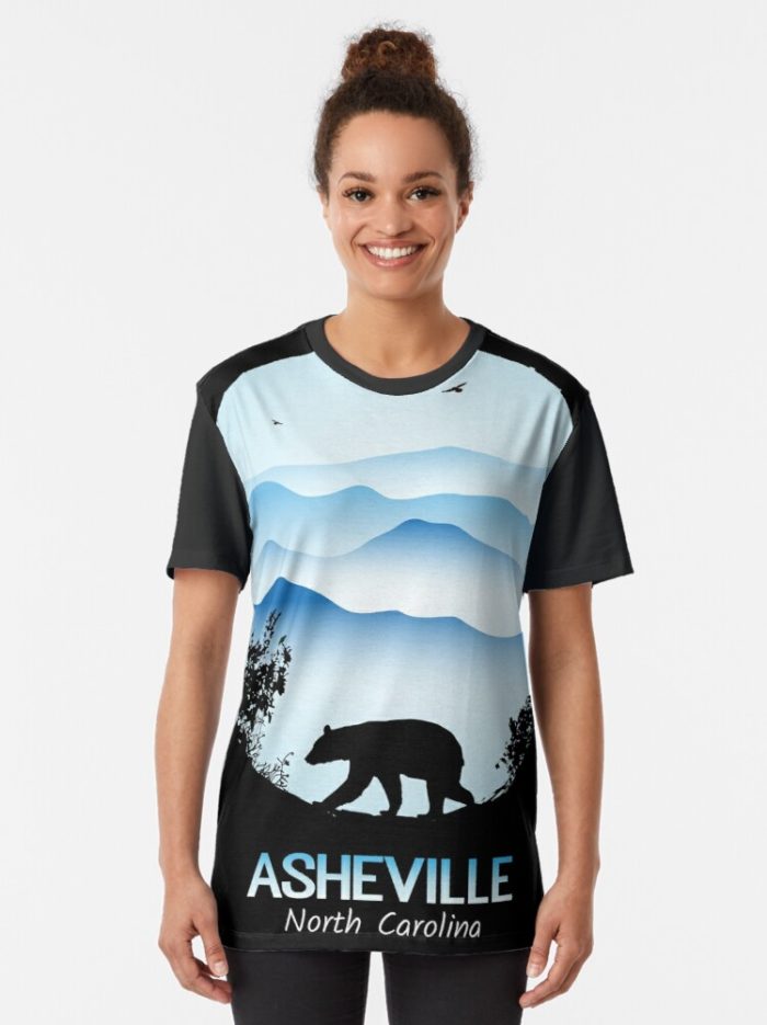 Asheville souvenir design with black bear and tree silhouette against the Blue Ridge Mountains of North Carolina.