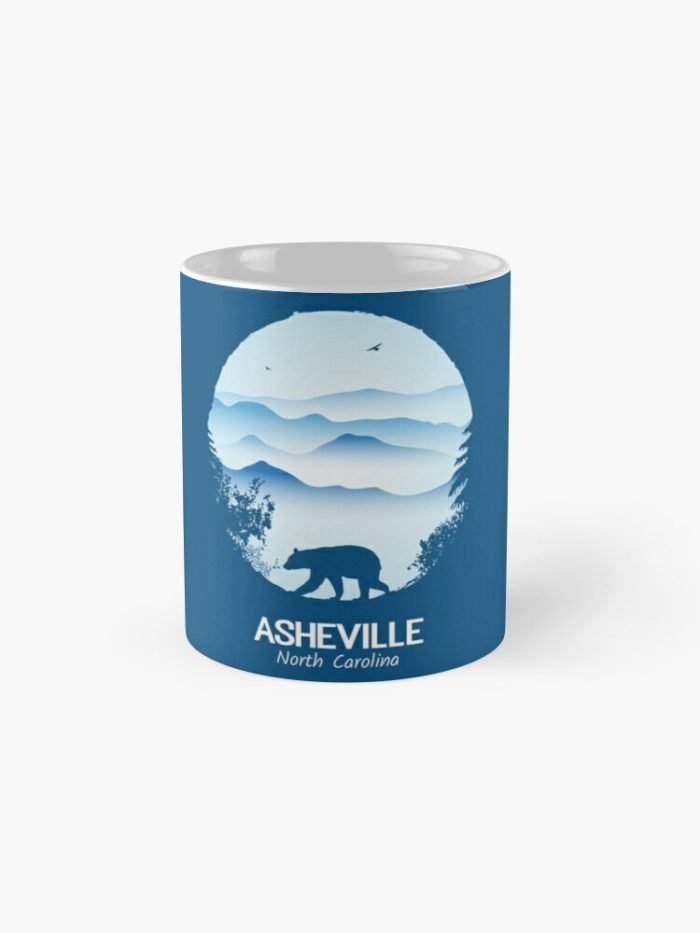 Asheville souvenir merchandise design with black bear and tree silhouette against the Blue Ridge Mountains of North Carolina.