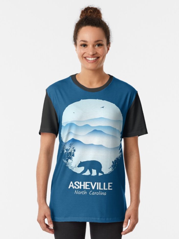 Asheville souvenir merchandise design with black bear and tree silhouette against the Blue Ridge Mountains of North Carolina.