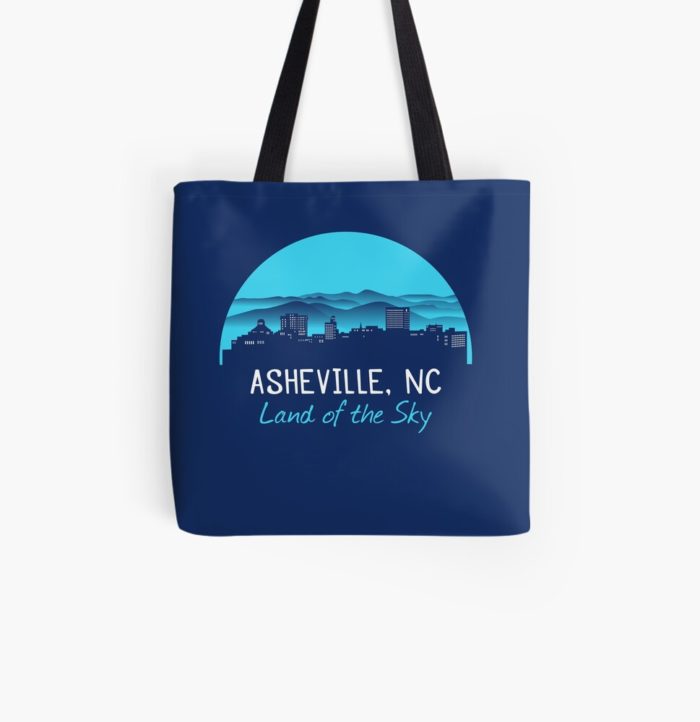 Asheville, North Carolina merchandise design with a cityscape against the Blue Ridge Mountains and Asheville's famous nickname"Land of the Sky." Asheville, North Carolina t-shirt design with hiker, mountains, birds, and trees.