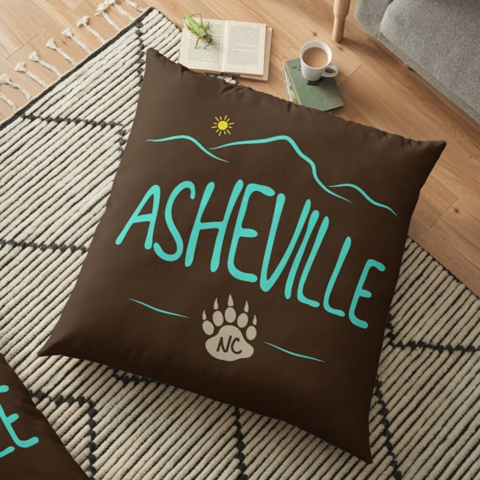 Asheville, NC design with mountains and a black bear paw print.